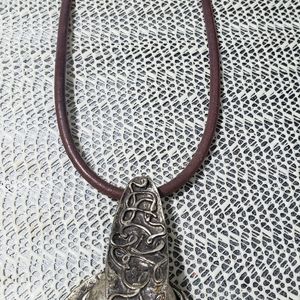 Statement necklace with brown leather choker.